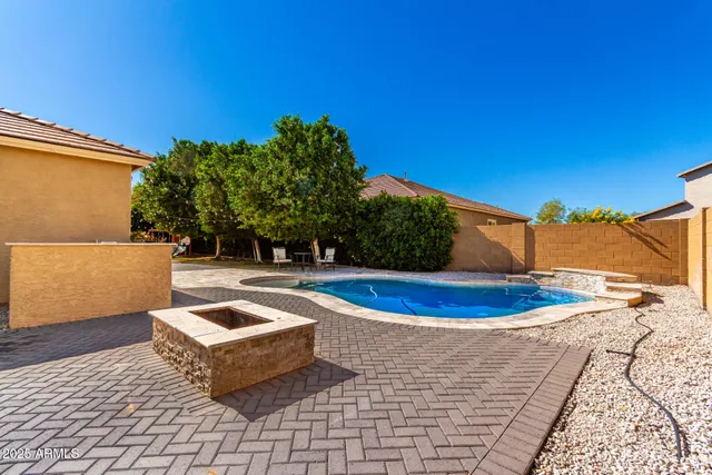 a view of a swimming pool with an outdoor space and seating area