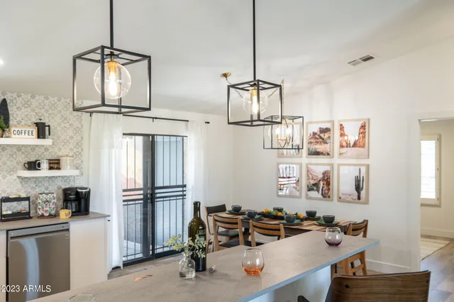 a kitchen with sink refrigerator and cabinets