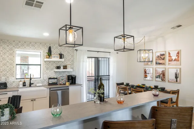 a dining room with furniture and window