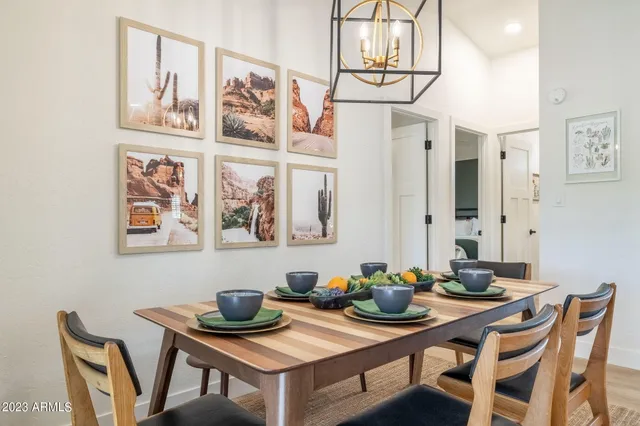 a room with furniture and potted plants