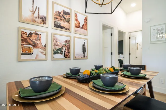 a large bed sitting in a bedroom next to a lamp