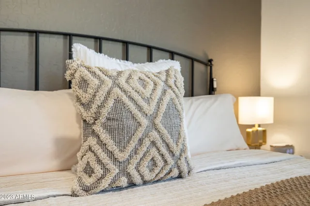 a bed room with a bed and a window