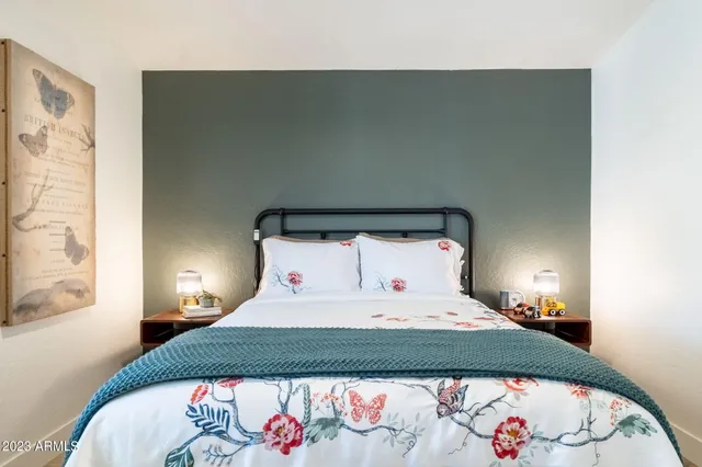 a bedroom with a bed and a window