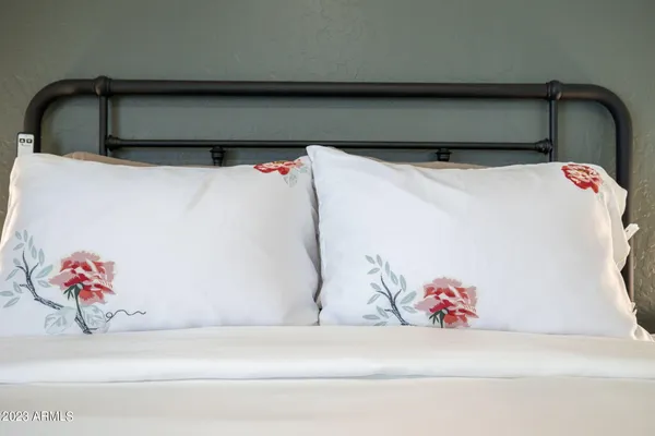 a bedroom with a bed and a walk in closet