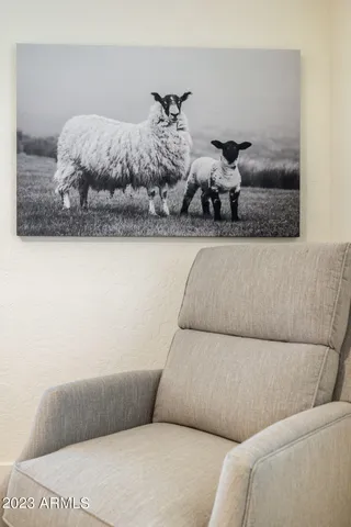 a blue and white car parked in front of a house