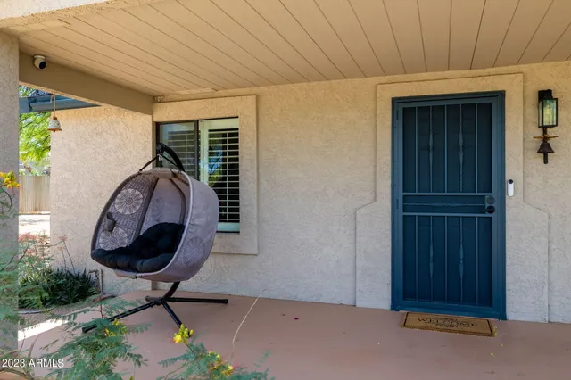 a room with painting and a table