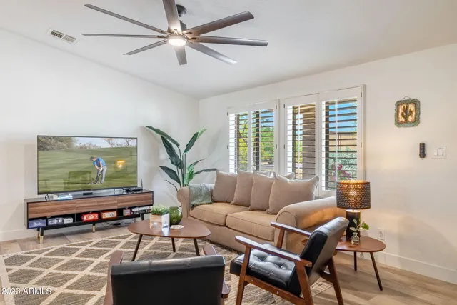 a living room with furniture and a large window