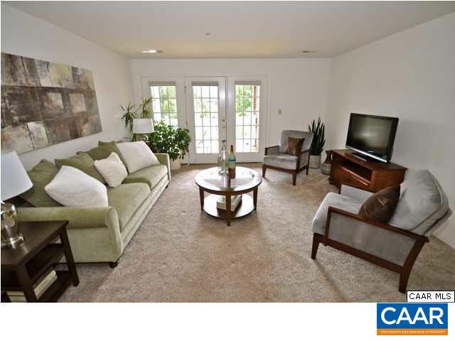 200 Lake Club Court, Unit 1 Charlottesville, VA 22902 - Photo 2 of 17 a living room with furniture and a flat screen tv