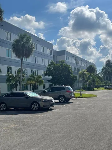 a view of street with parked cars