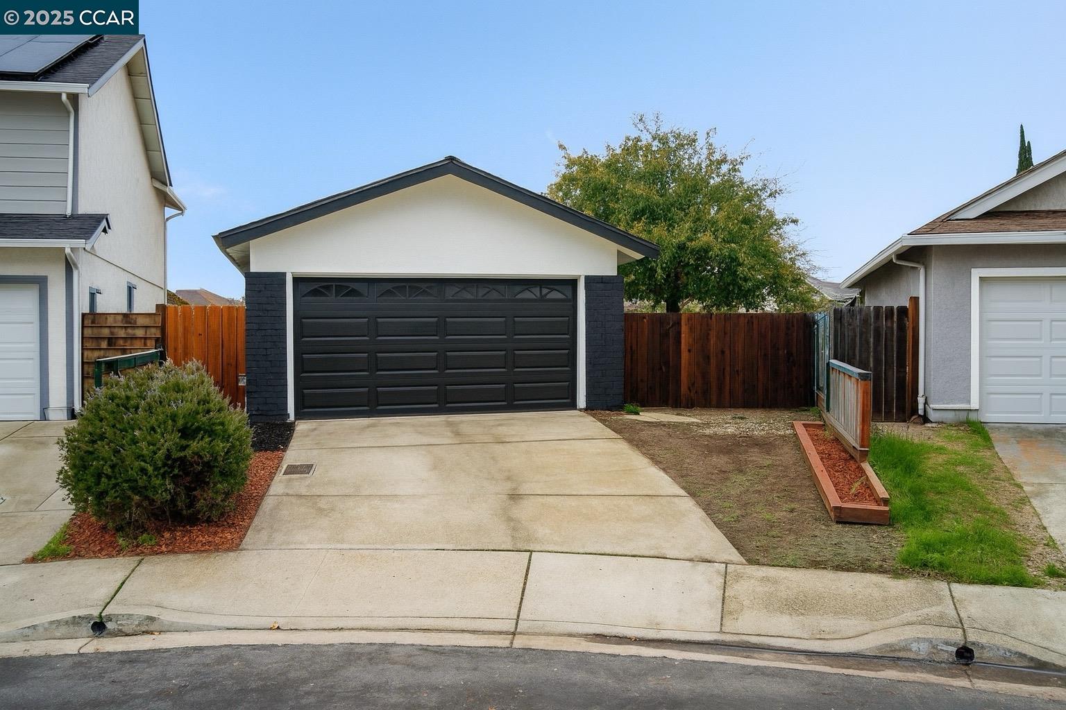 a front view of a house with garage