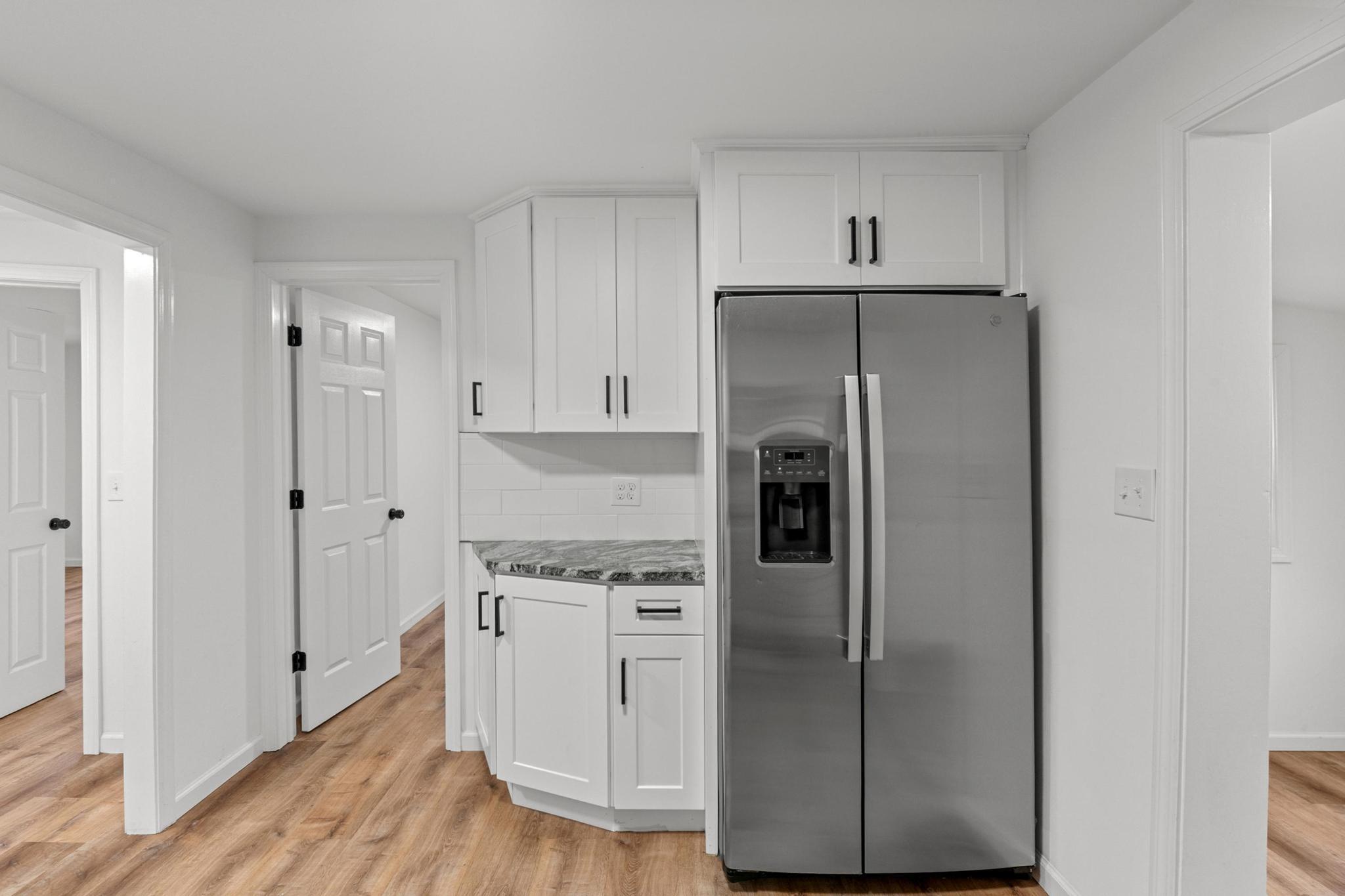 5 Pine Trail Avon, CT 06001 - Photo 12 of 26 a kitchen with stainless steel appliances a refrigerator and cabinets