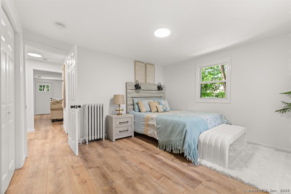 5 Pine Trail Avon, CT 06001 - Photo 19 of 26 a bedroom with a bed and a table