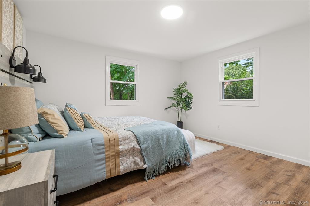 5 Pine Trail Avon, CT 06001 - Photo 20 of 26 a bedroom with a bed and a window