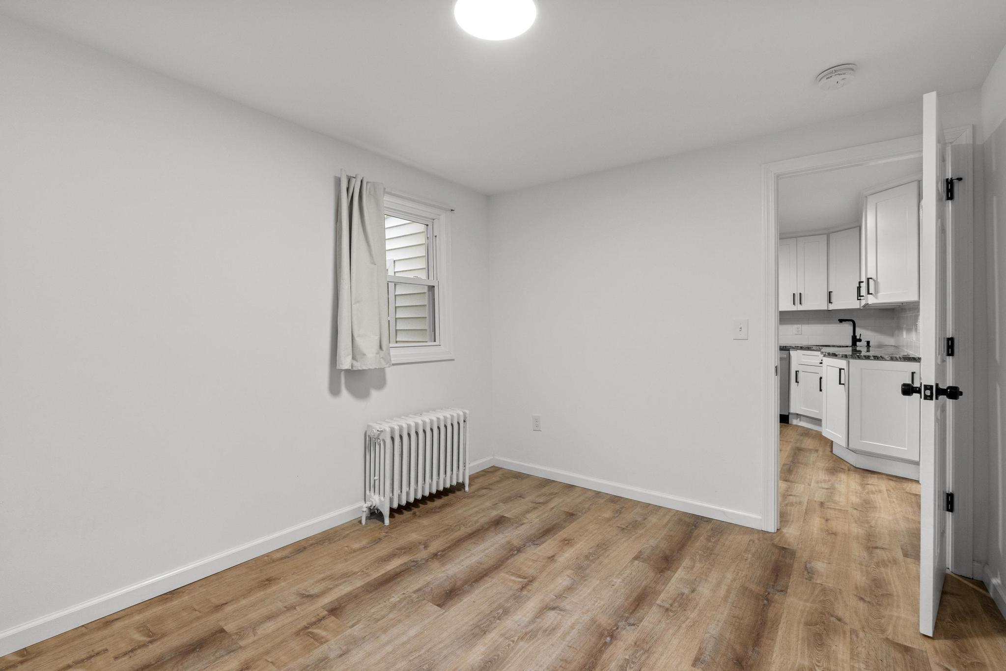 5 Pine Trail Avon, CT 06001 - Photo 22 of 26 a view of empty room with wooden floor