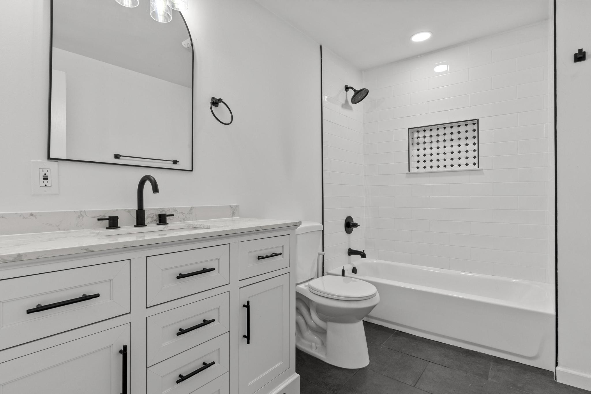 5 Pine Trail Avon, CT 06001 - Photo 23 of 26 a bathroom with a toilet sink a mirror and shower