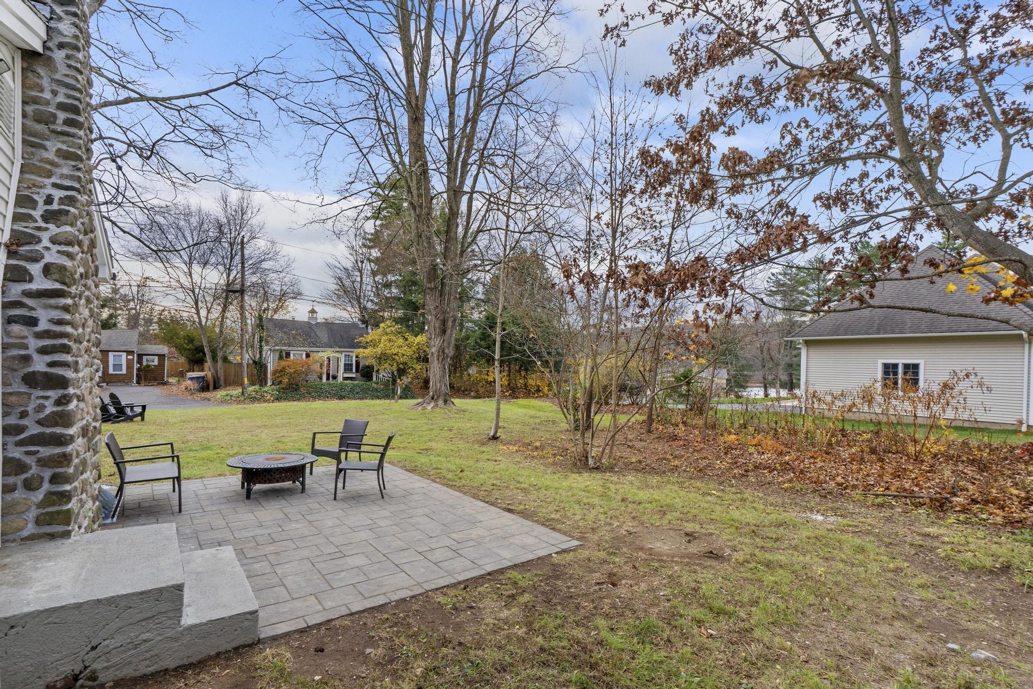 5 Pine Trail Avon, CT 06001 - Photo 24 of 26 a view of a house with backyard and trees