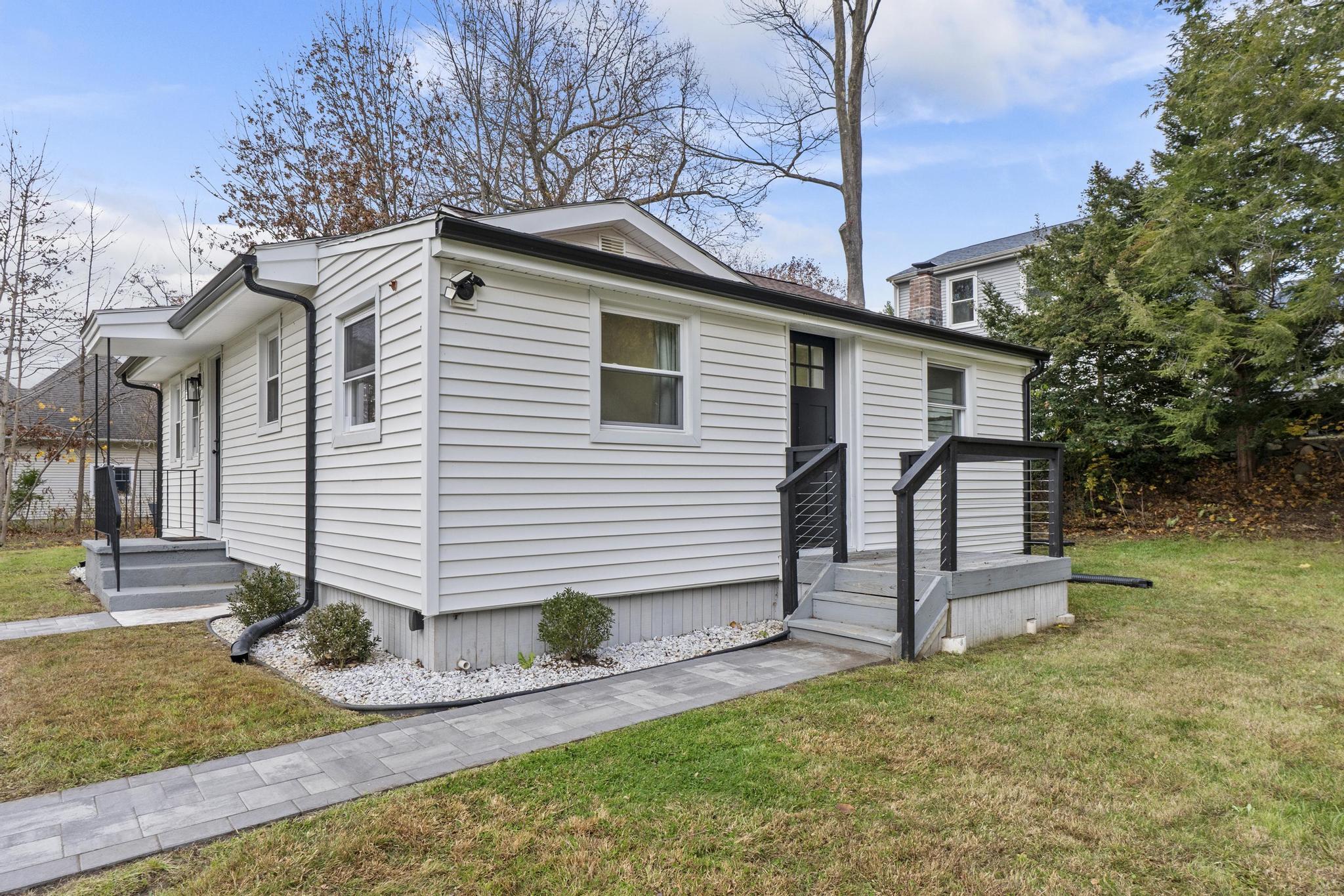 5 Pine Trail Avon, CT 06001 - Photo 25 of 26 a view of a house with a yard