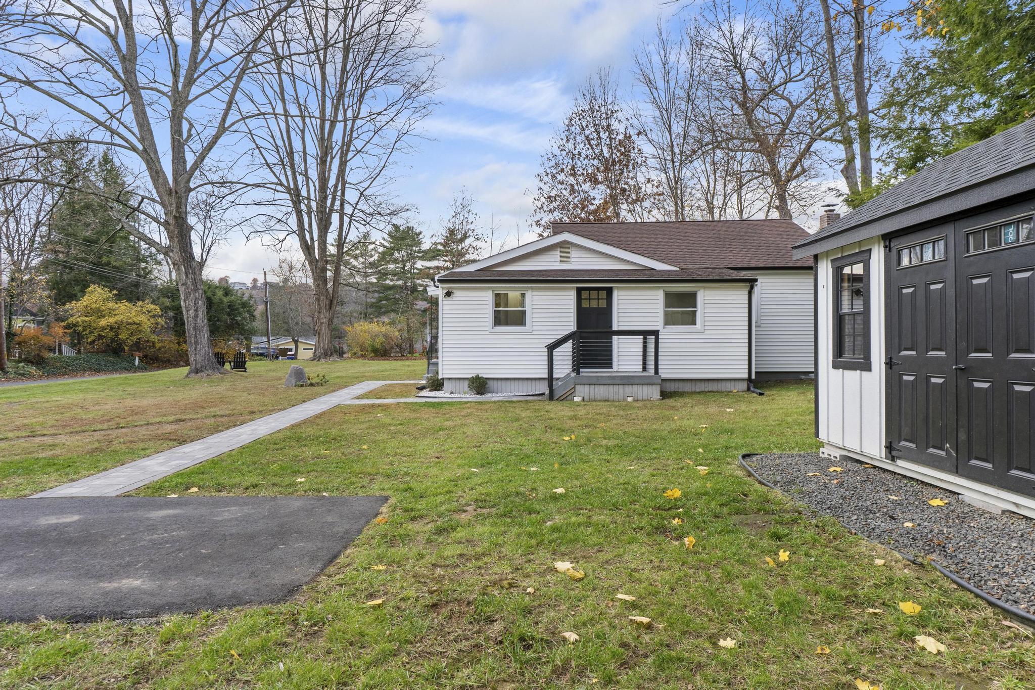 5 Pine Trail Avon, CT 06001 - Photo 26 of 26 a front view of a house with garden