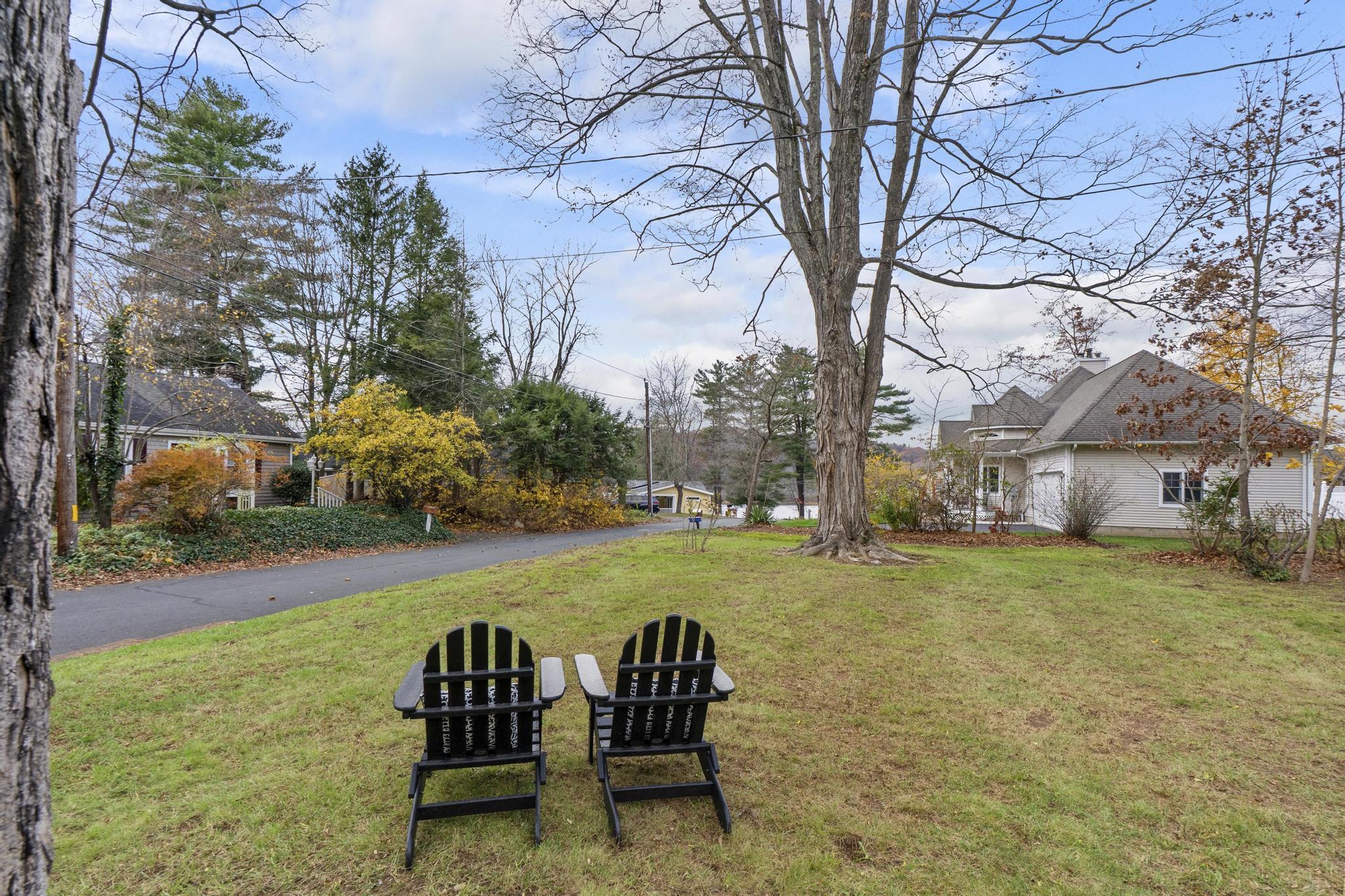 5 Pine Trail Avon, CT 06001 - Photo 3 of 26 a view of a chairs in backyard of house