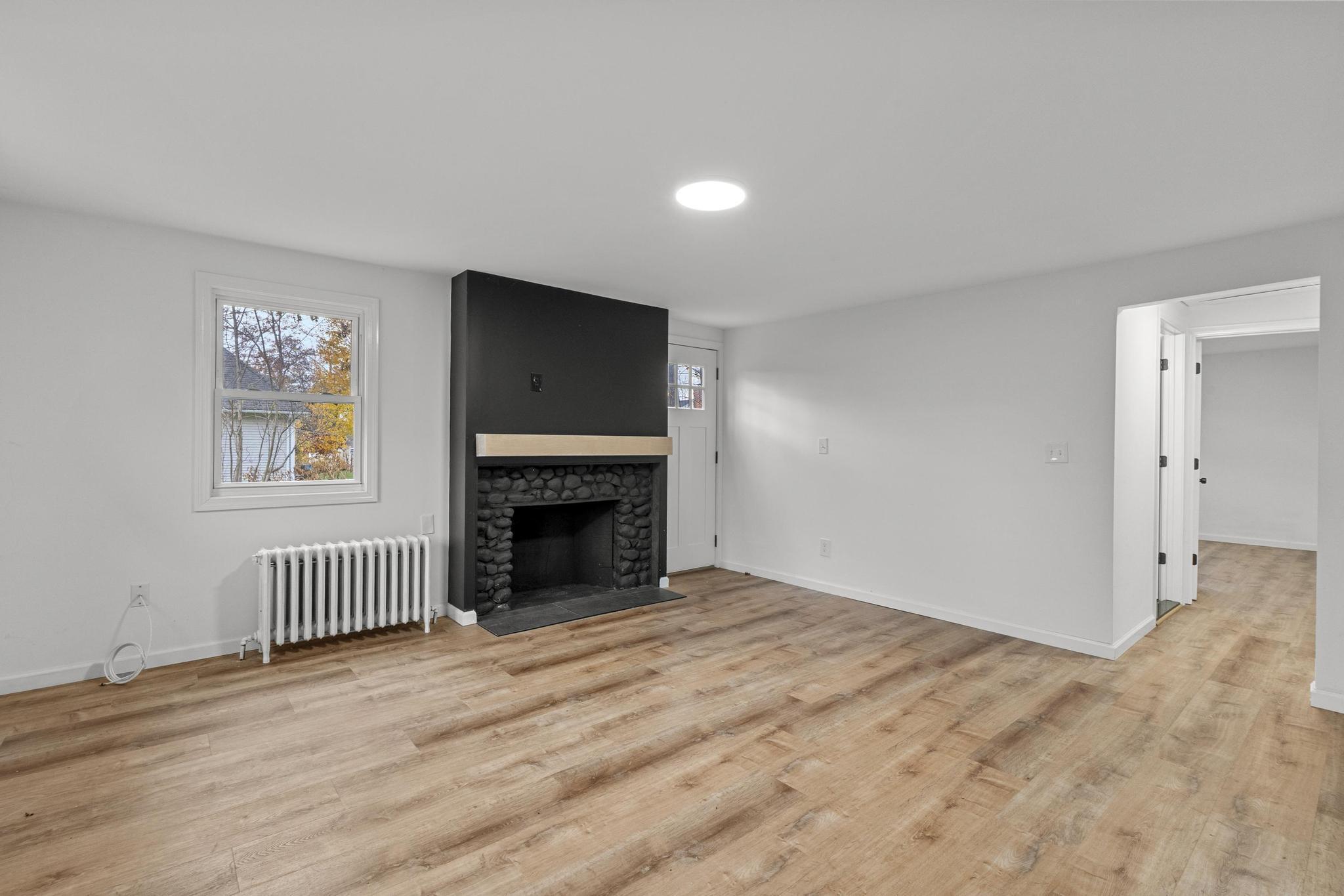 5 Pine Trail Avon, CT 06001 - Photo 6 of 26 a view of empty room with a fireplace