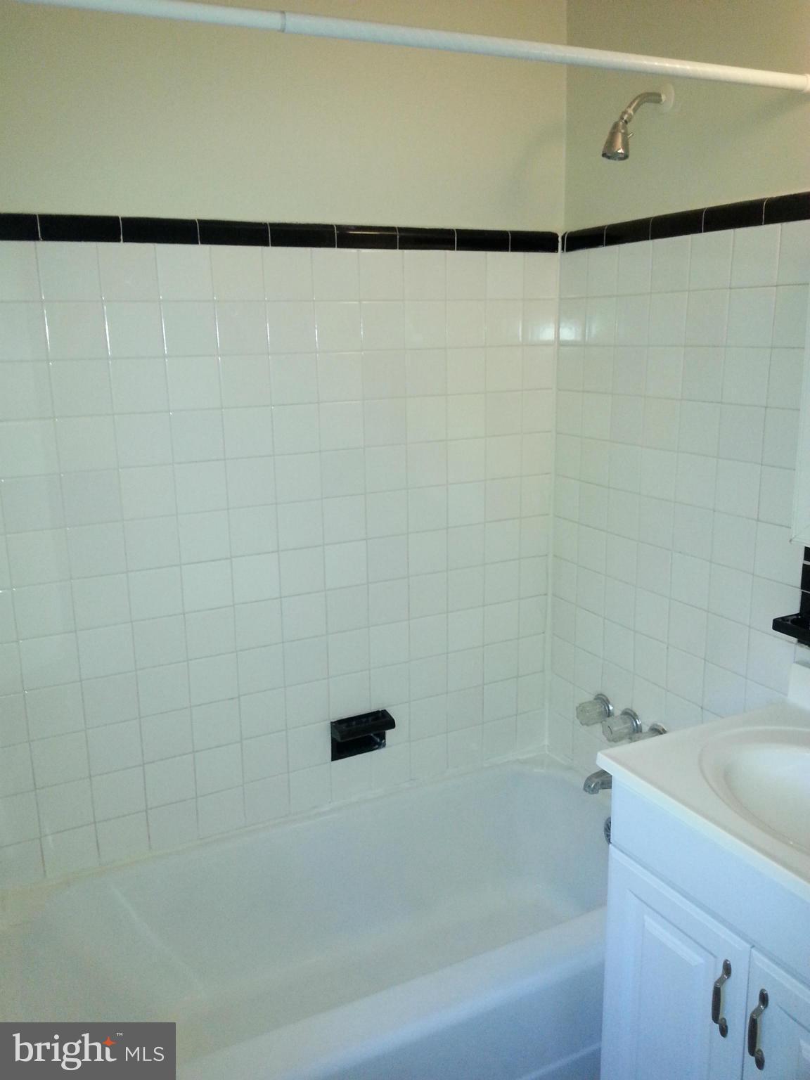 10001 Brunett Avenue Silver Spring, MD 20901 - Photo 15 of 23 a bathroom with a shower and a sink