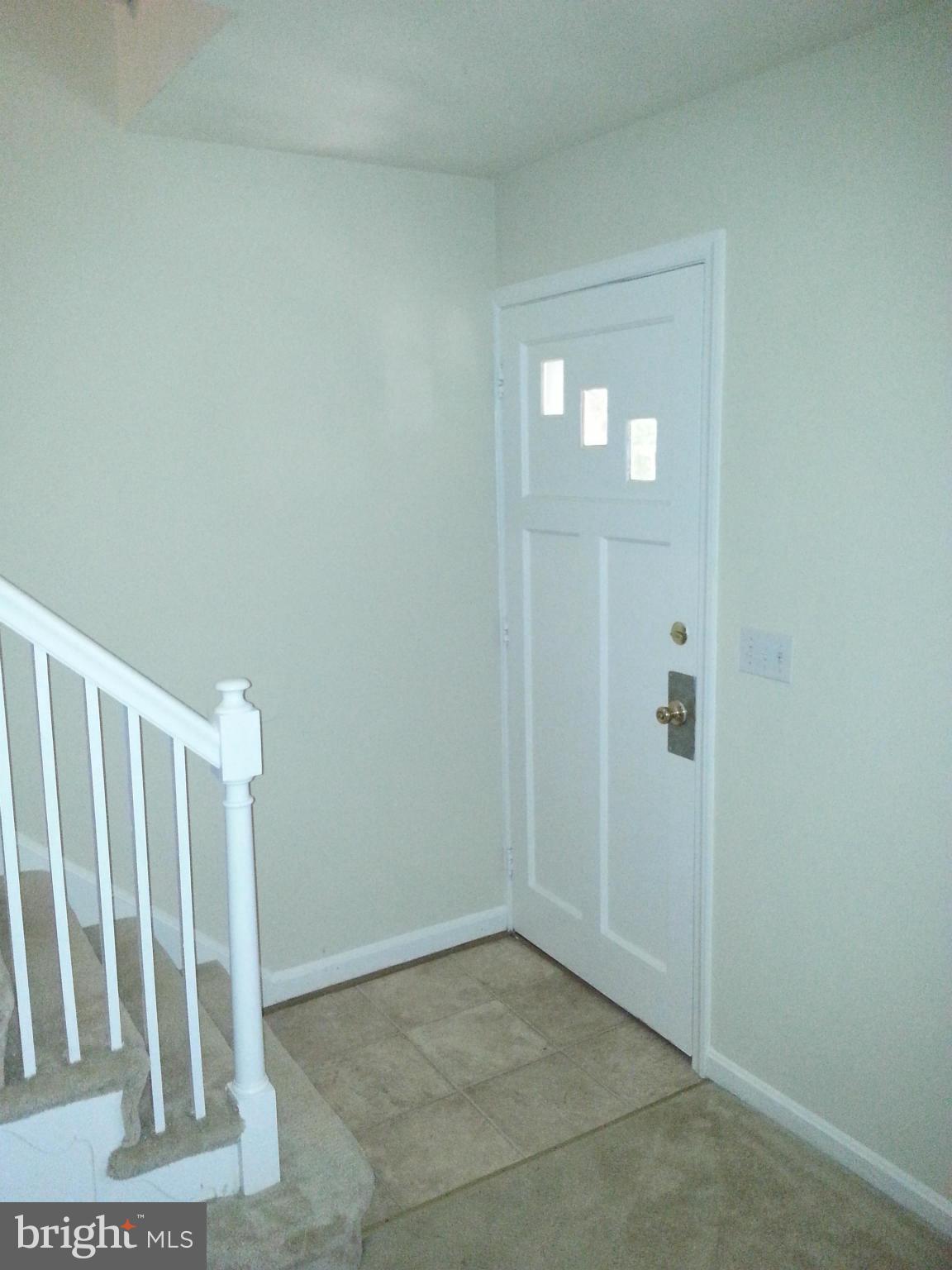 10001 Brunett Avenue Silver Spring, MD 20901 - Photo 2 of 23 a view of entryway with wooden floor