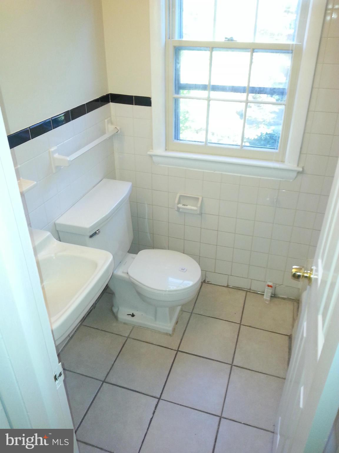 10001 Brunett Avenue Silver Spring, MD 20901 - Photo 22 of 23 a bathroom with a toilet and a shower