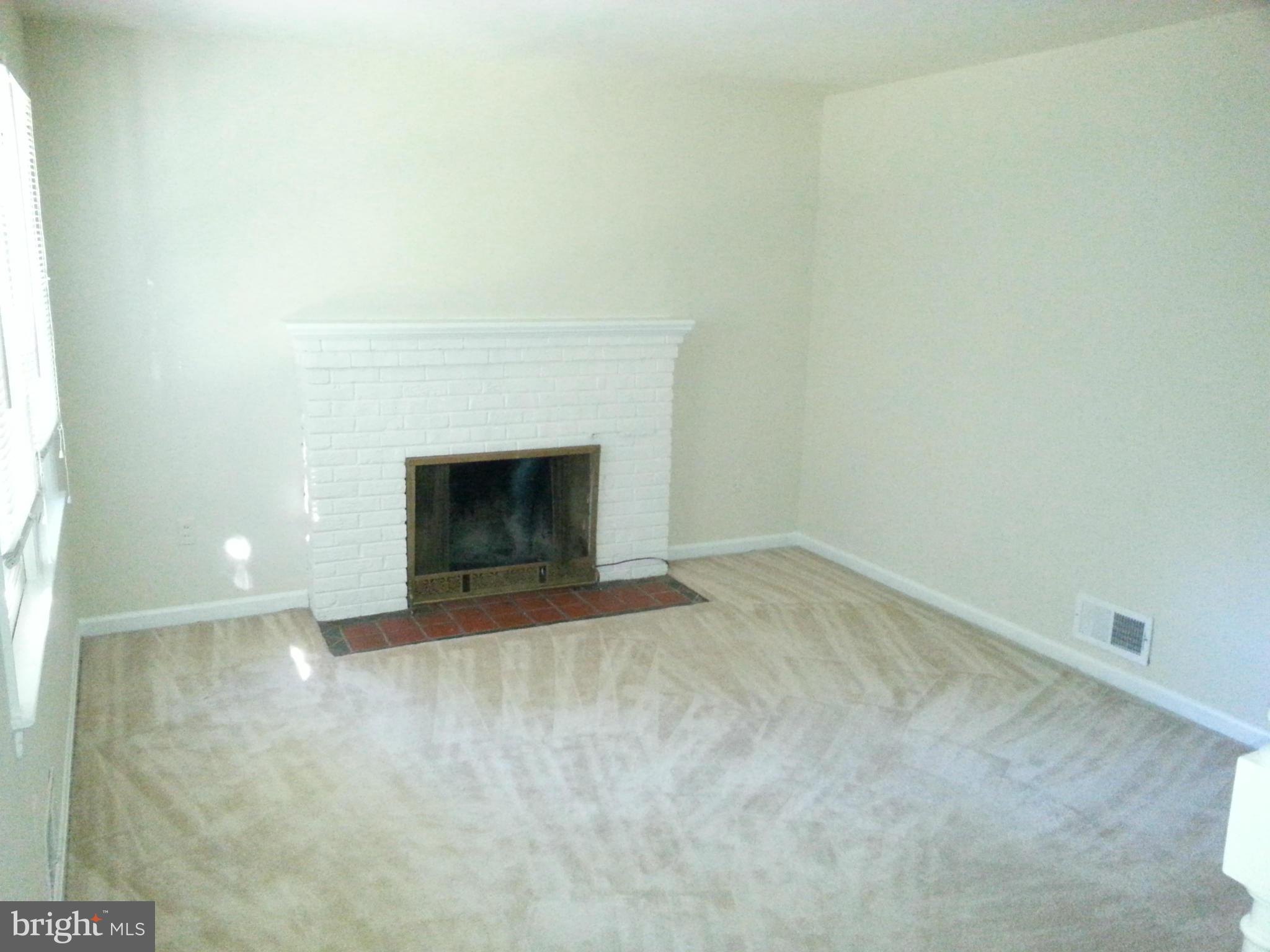 10001 Brunett Avenue Silver Spring, MD 20901 - Photo 3 of 23 a view of empty room with a fireplace