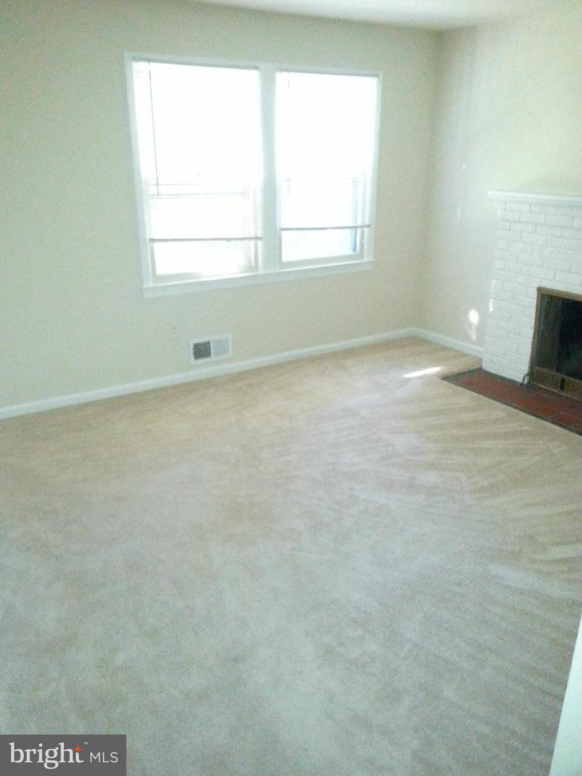 10001 Brunett Avenue Silver Spring, MD 20901 - Photo 4 of 23 an empty room with a window