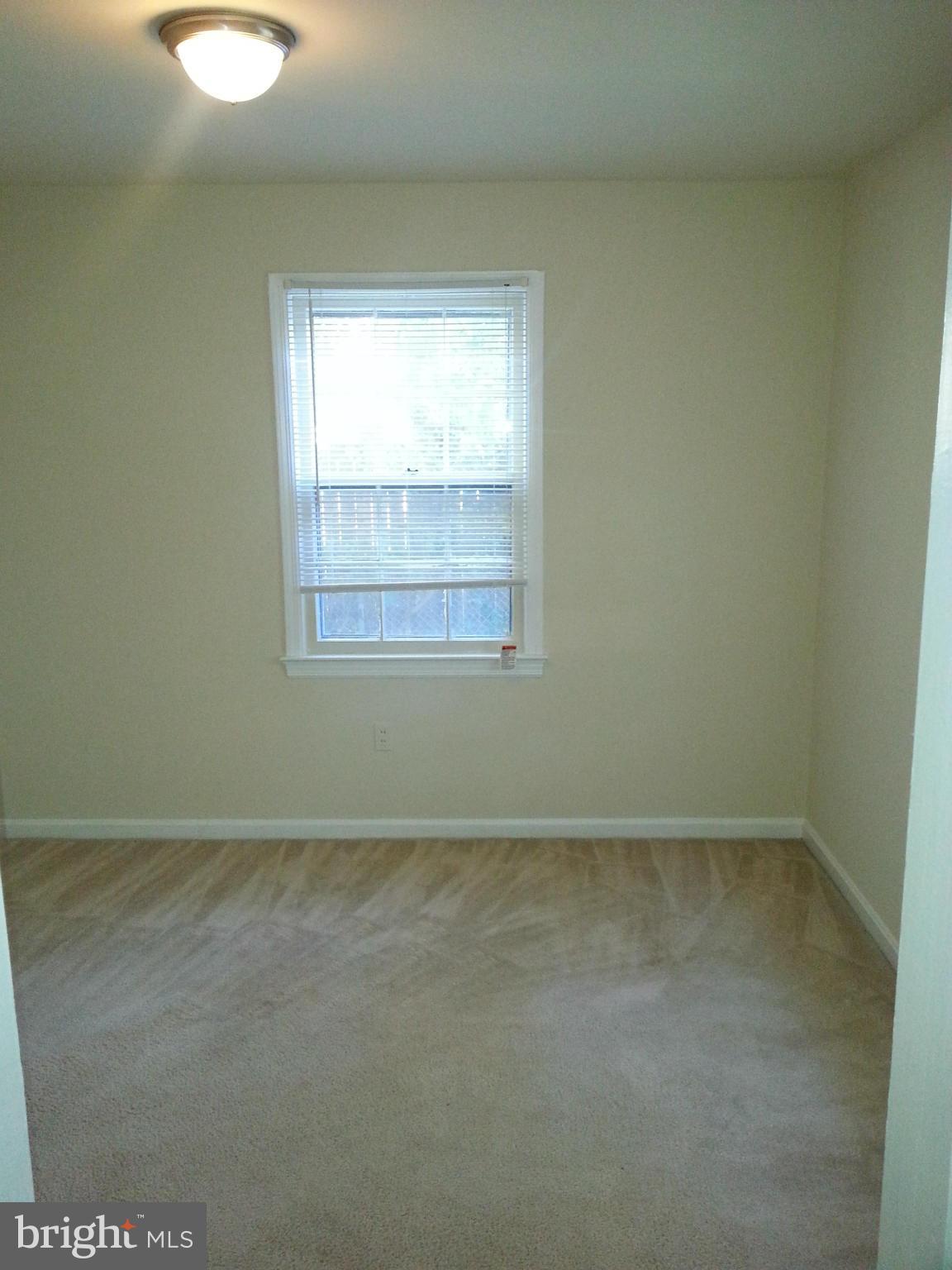 10001 Brunett Avenue Silver Spring, MD 20901 - Photo 6 of 23 an empty room with a window