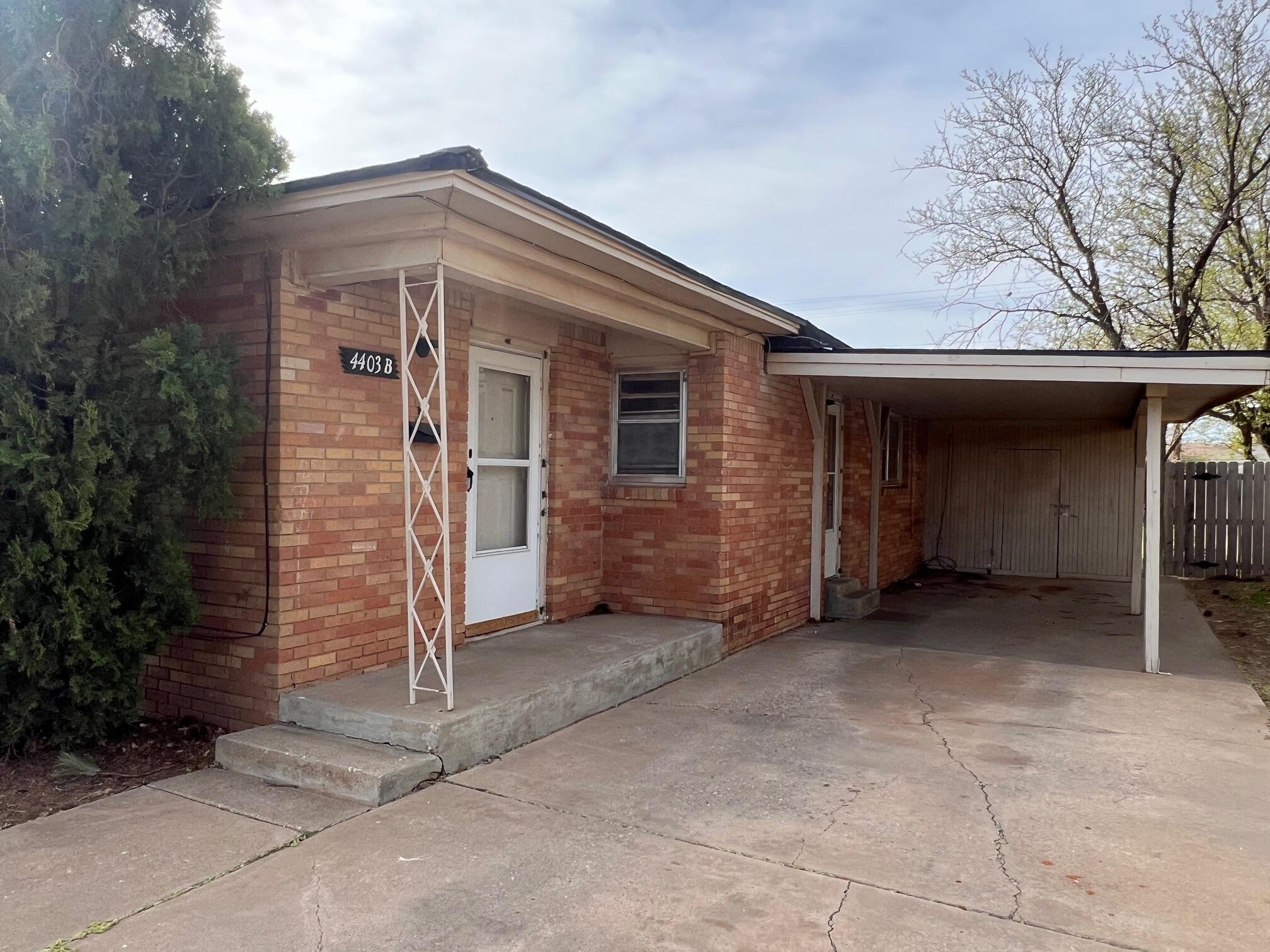 a house with yard in front of it