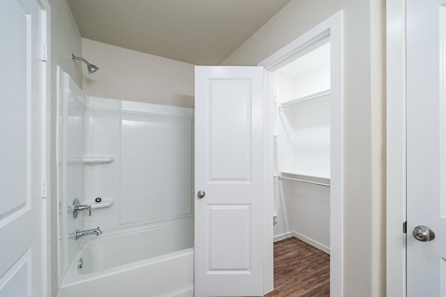 9706 Saratoga Avenue Lubbock, TX 79424 - Photo 6 of 11 a bathroom with a bathtub and a shower