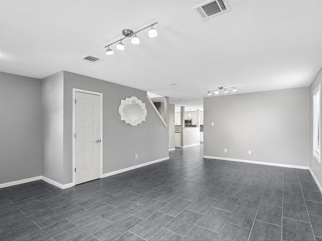 5304 Los Altos Road Fort Worth, TX 76244 - Photo 3 of 30 Unfurnished living room featuring rail lighting