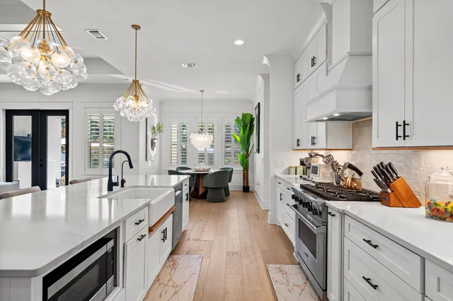 a work room with furniture and a chandelier