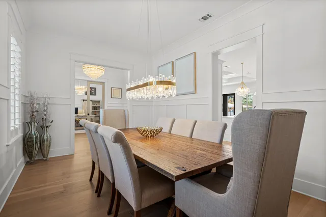 a bedroom with a bed lamp and a window