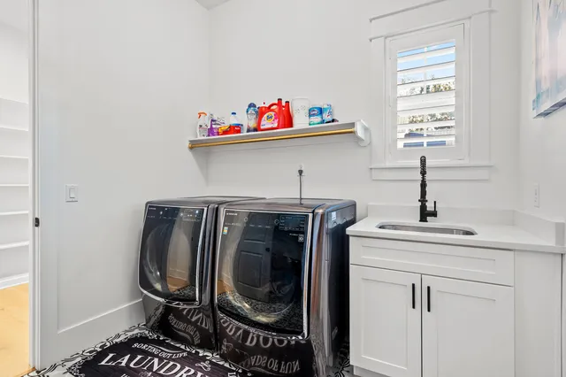 a view of an house with backyard porch and outdoor kitchen