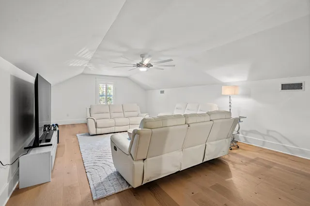 a view of a swimming pool with a garden and plants