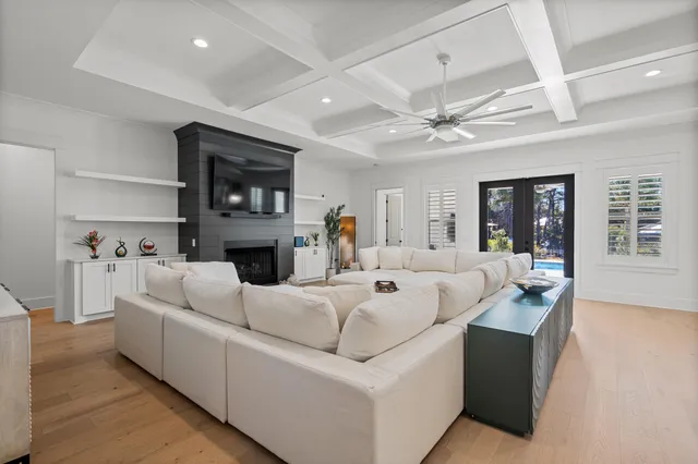 a kitchen with stainless steel appliances a table chairs and a chandelier
