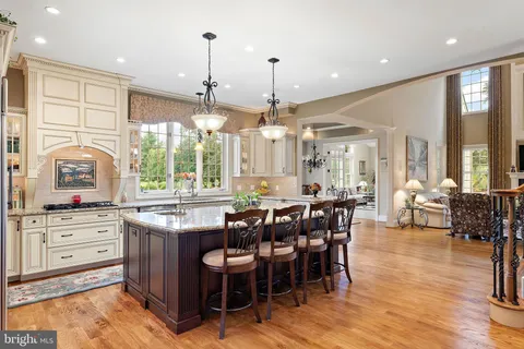 a view of a dining room with furniture wooden floor and chandelier