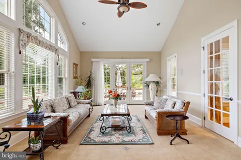 a living room with furniture and a rug