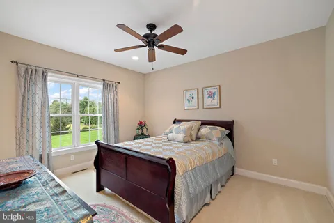 a view of a swimming pool and outdoor seating