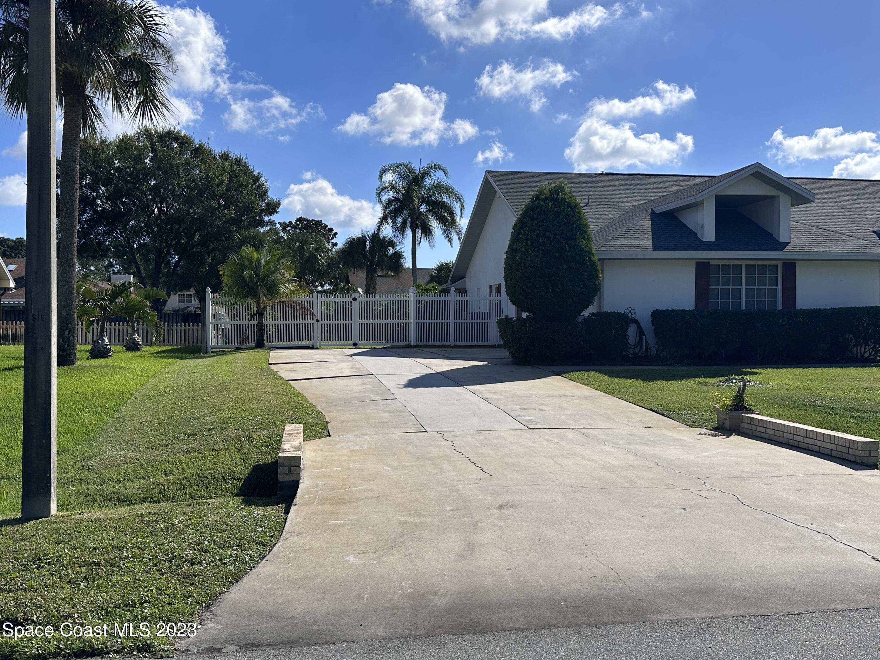 1369 Elcon Drive Melbourne, FL 32904 - Photo 12 of 13 a house view with a garden space