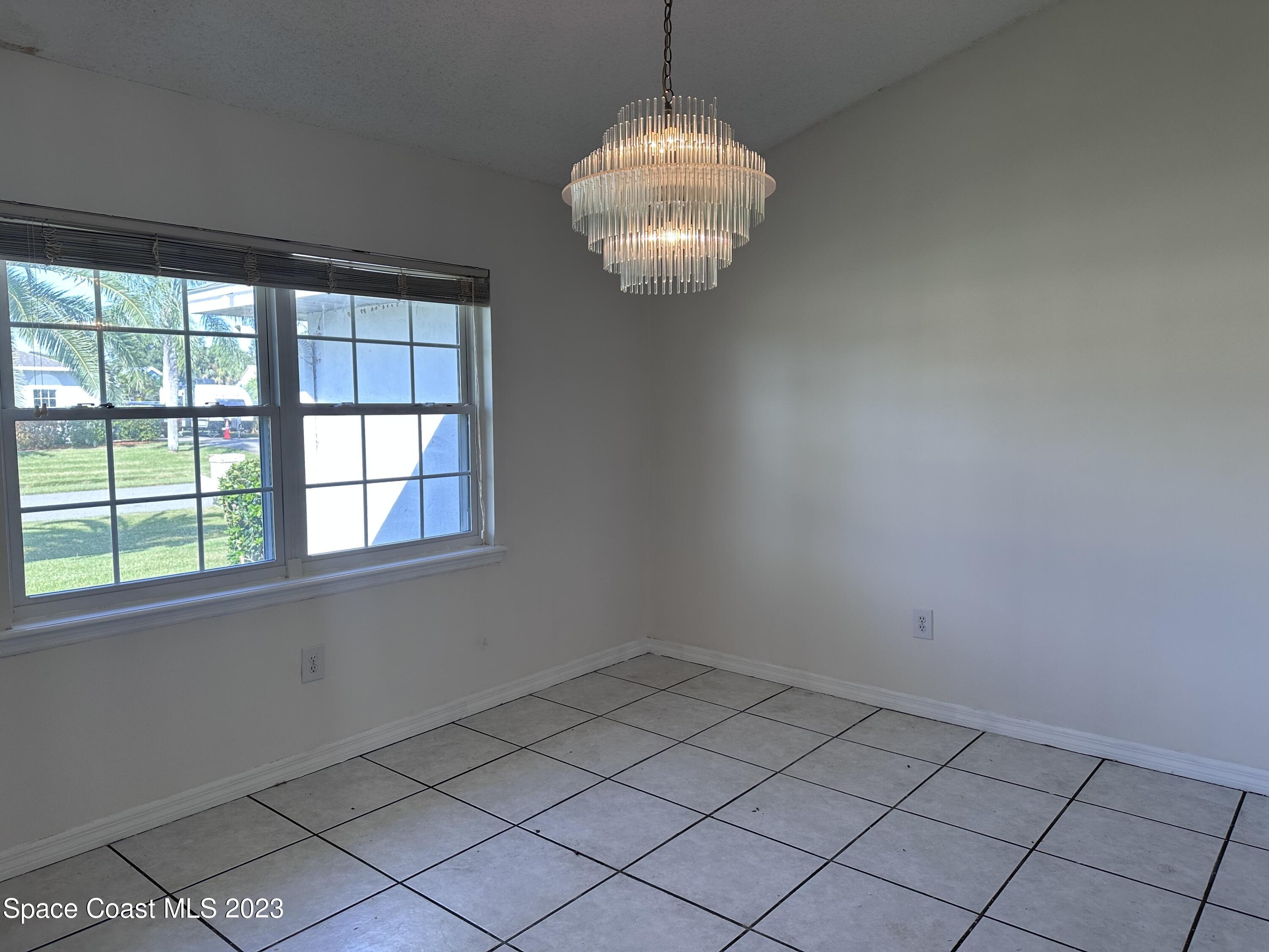 1369 Elcon Drive Melbourne, FL 32904 - Photo 10 of 13 en empty room with a window