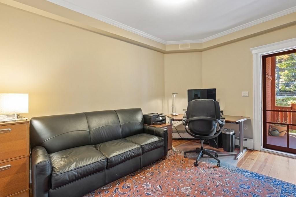 20 Strathmore Road, Unit 2 Brookline, MA 02445 - Photo 20 of 28 a living room with furniture a rug and a window