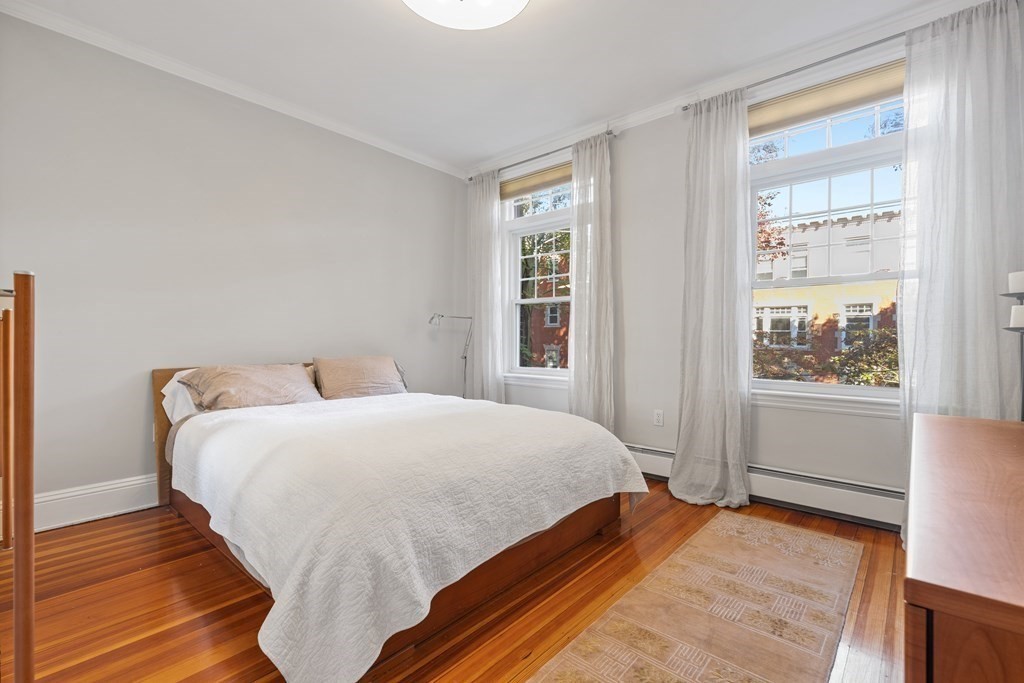20 Strathmore Road, Unit 2 Brookline, MA 02445 - Photo 21 of 28 a bedroom with a bed and a window