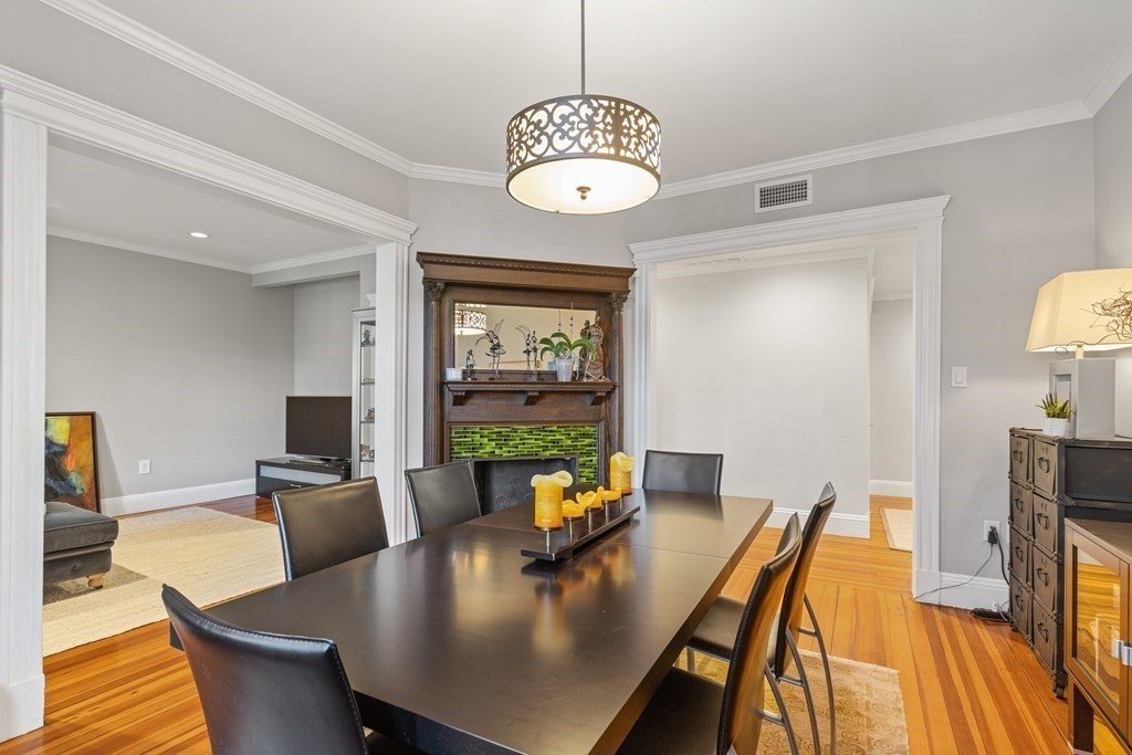 20 Strathmore Road, Unit 2 Brookline, MA 02445 - Photo 3 of 28 a view of a dining room with furniture a chandelier and wooden floor