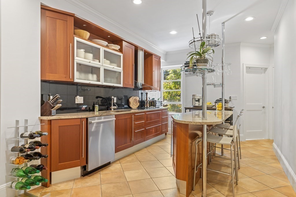 20 Strathmore Road, Unit 2 Brookline, MA 02445 - Photo 8 of 28 a kitchen with stainless steel appliances granite countertop a stove a sink and a refrigerator