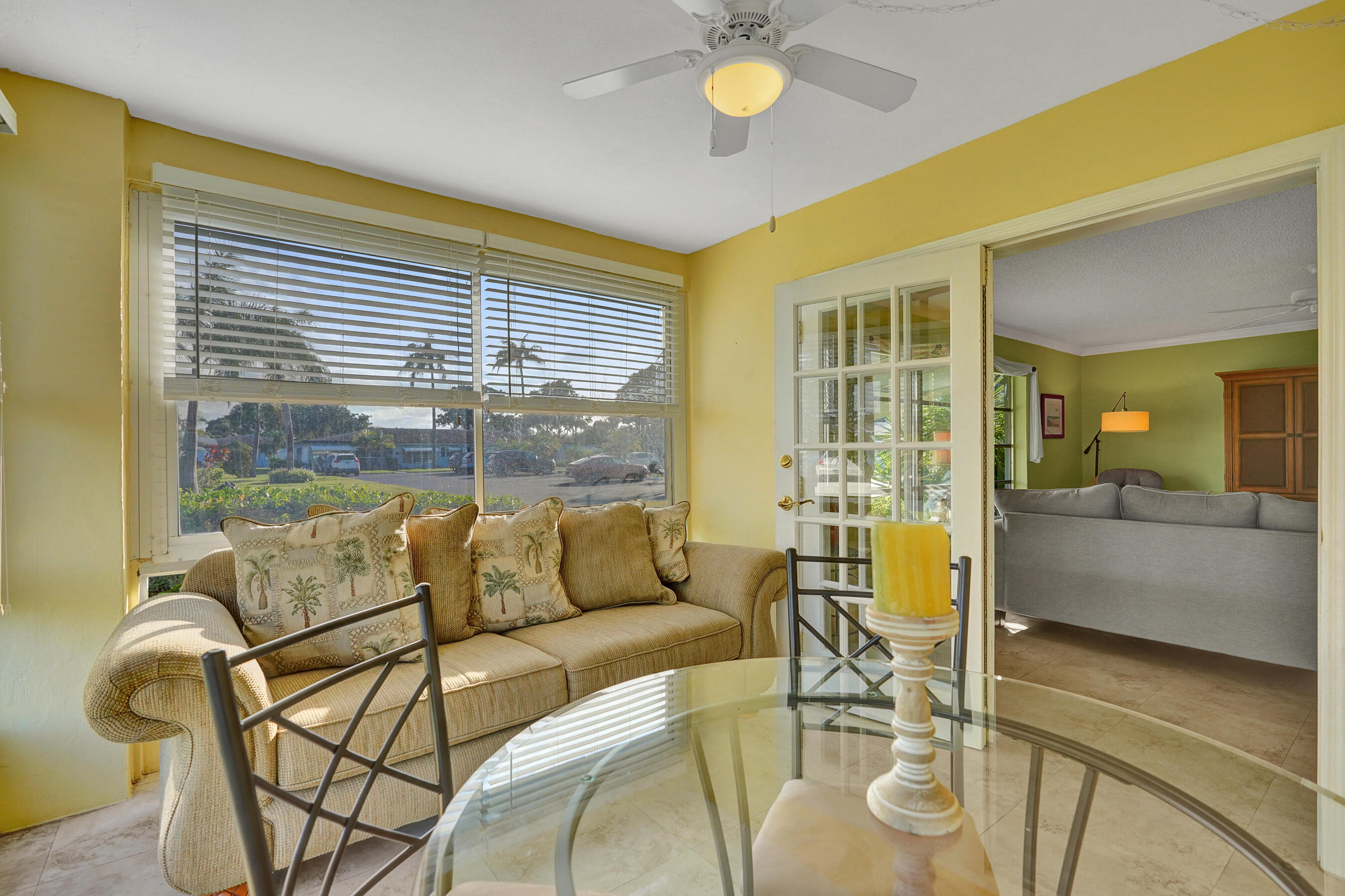 515 High Point Drive, Unit A Delray Beach, FL 33445 - Photo 20 of 60 a living room with furniture and a large window