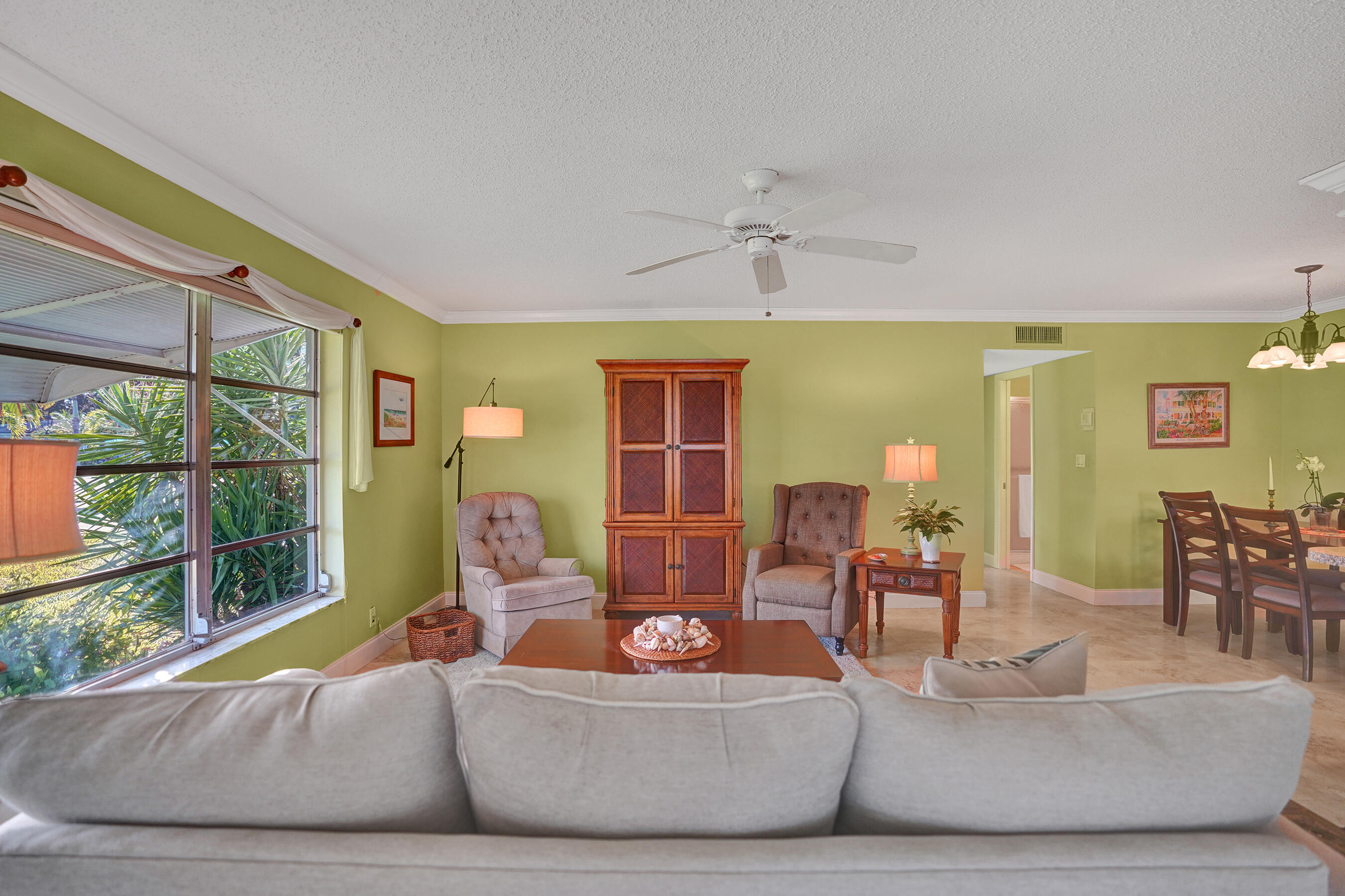 515 High Point Drive, Unit A Delray Beach, FL 33445 - Photo 21 of 60 a living room with furniture and a large window