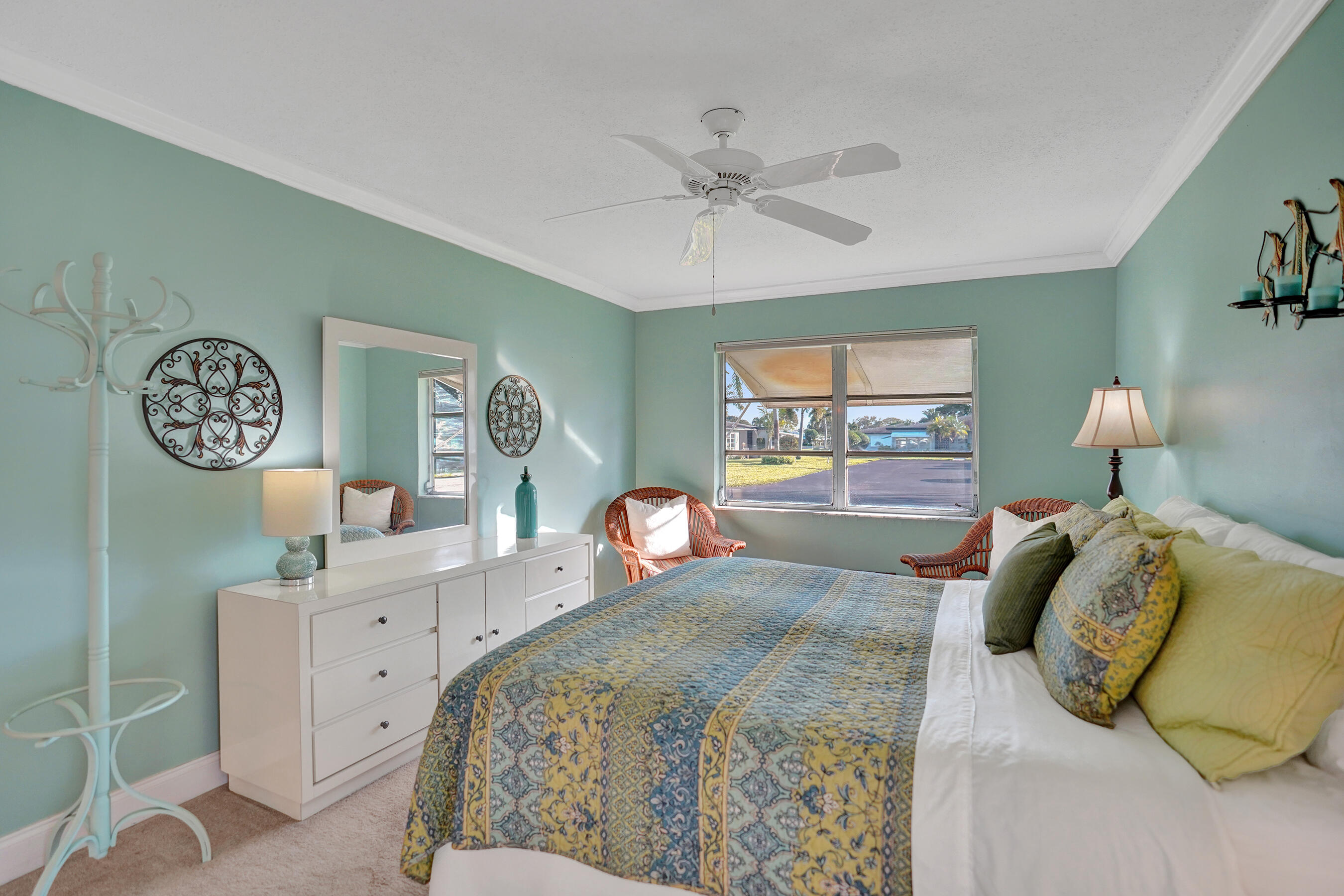 515 High Point Drive, Unit A Delray Beach, FL 33445 - Photo 33 of 60 a bedroom with a bed and a window